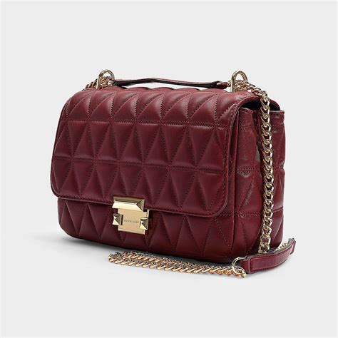 michael kors maroon quilted bag|Michael Kors large shoulder bag.